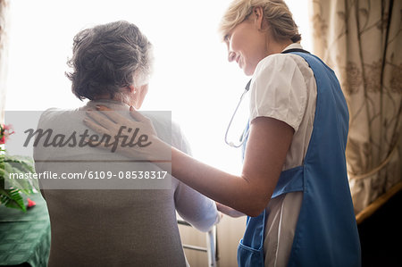 Nurse taking care of a senior woman