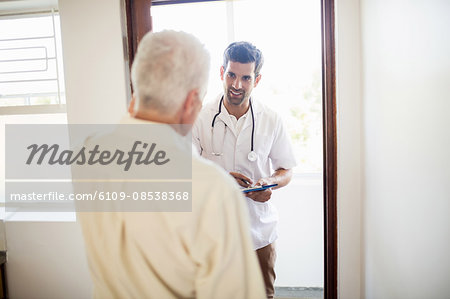 Nurse visiting senior man