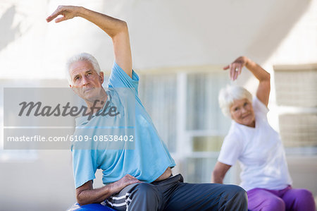 Senior couple doing exercises
