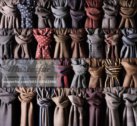 Close-up of rows of coloured and knotted scarves