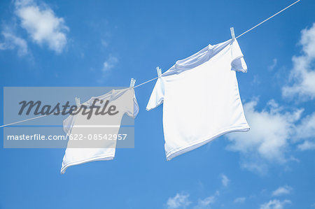 Laundry hanging against blue sky