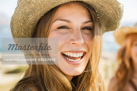 Close up portrait of happy mid adult woman at coast, Cape Town, South Africa