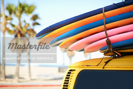 Multi-coloured surfboards tied onto vehicle, Venice Beach, Los Angeles, USA