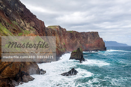 Inaccessible shores of the rocky island in Anlantic ocean. Madeira island coast, Portugal.