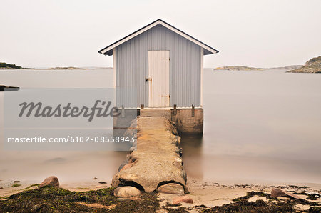 View of small shed on coastline