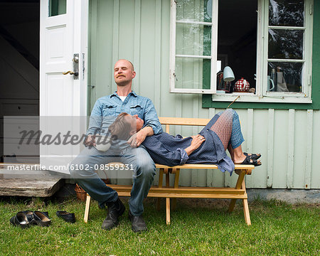 Mature couple in front of house, Molle, Sweden