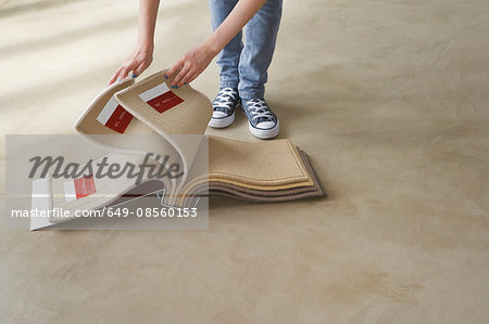 Woman looking at carpet samples