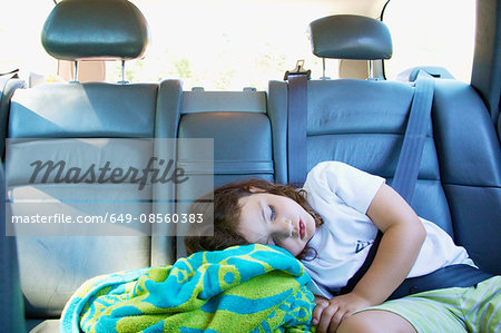 Girl asleep in car with seat belt on