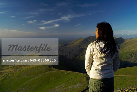 woman looking at view from hill