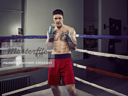 Boxer with fists up in ring