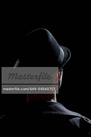 Man wearing black hat and jacket