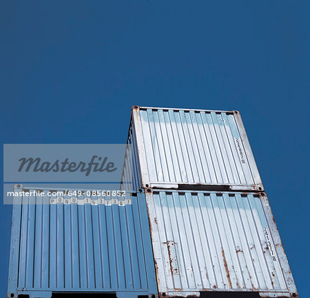 Shipping containers against blue sky