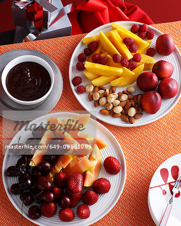 Plates of fresh fruit and nuts Plates of fresh fruit and nuts