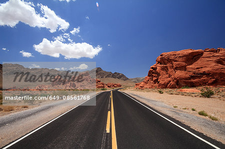 Rural road and red rock formations