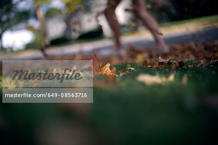 Person kicking leaves