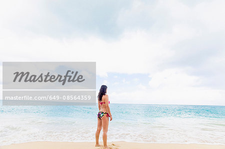 Woman wearing bikini on beach, St Maarten, Netherlands