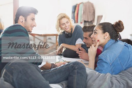 College students studying on bed