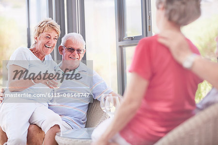 Senior couples drinking wine