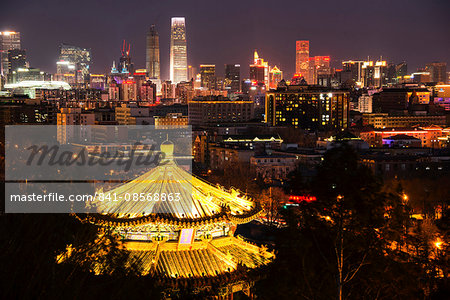 Illuminated pagoda and Beijing cityscape at night, Beijing, China, Asia