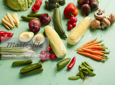 Overhead view of vegetables on green background