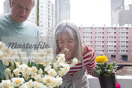 Couple gardening on balcony
