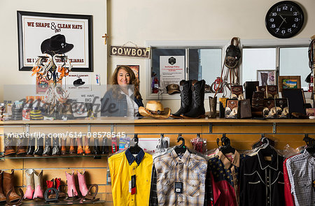 Shop assistant behind service counter