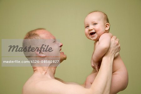 Baby boy (2-5 months) with his father