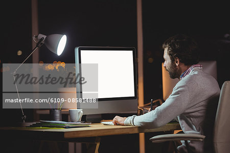 Concentrated man front of computer