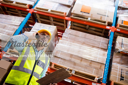 Warehouse worker on a phone call