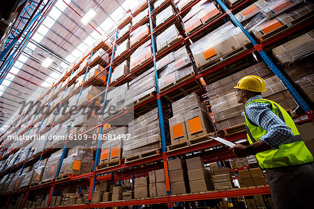 Warehouse worker walking in an aisle