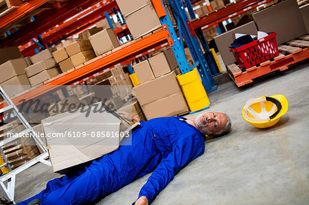 Unconscious worker lying on the floor