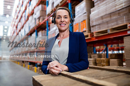 Warehouse manager looking at camera