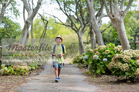 Little boy walking on path