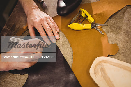 High angle view of hands with blade