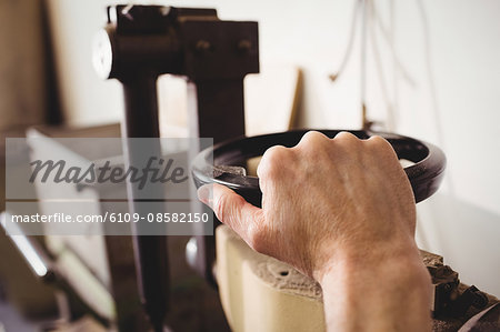 Close up of hand using a machine