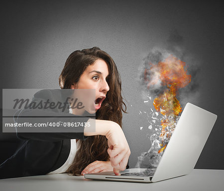 Astonished woman looks at the computer inflamed