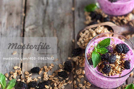 Mulberry smothie with homemade granola copy space background