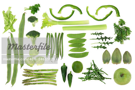 Green fresh vegetable and fruit selection over white background, high in antioxidants and vitamins.