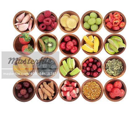 Health super food selection for cold and flu remedy high in antioxidants, anthocyanins  and vitamins in wooden bowls over white background.