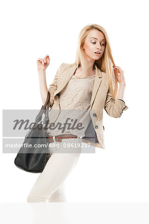 Young excited woman looking at the shop window isolated over white