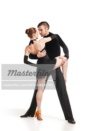 Beautiful two professional artists dancing over white background