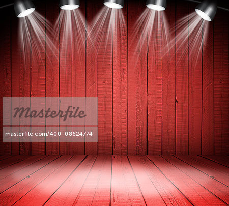 Illuminated empty red concert stage with soffits