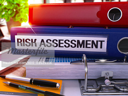 Risk Assessment - Blue Office Folder on Background of Working Table with Stationery and Laptop. Risk Assessment Business Concept on Blurred Background. Risk Assessment Toned Image. 3D.