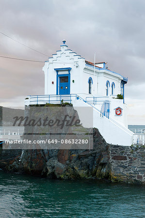 White building on coastal rocks