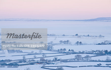 Aerial view of snowy rural landscape