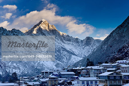 Mountain overlooking snowy village Mountain overlooking snowy village