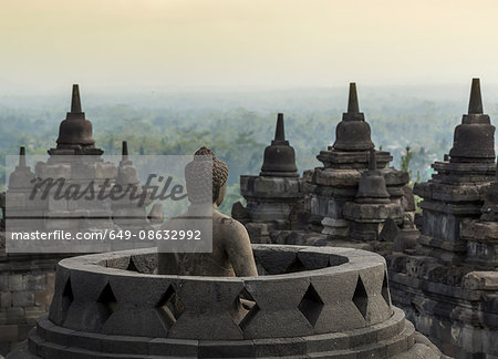 Buddha and rooftops, The Buddhist Temple of Borobudur, Java, Indonesia