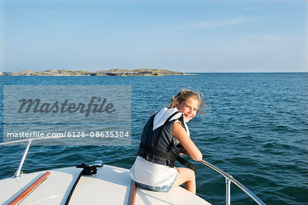 Sweden, Sodermanland, Stockholm Archipelago, Varmdo, Norsten, Portrait of girl (12-13) on boat