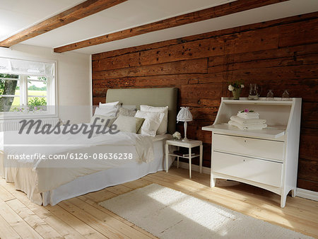 Sweden, Scandinavian style bedroom with wood and white color theme