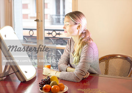 Woman doing a session of light therapy